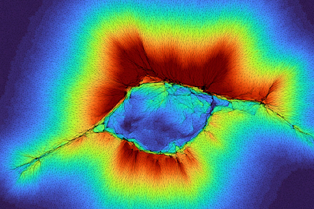 In this model, cell clusters can “feel” farther beyond their surrounding environment in the human body by acting as a collective, shown here “reaching out”  with the red indicating the spatial distribution of the collagen deformation over a layer of stiff tissue. WashU researchers share details on this emergent property in the journal PNAS. (Image: Pathak lab)